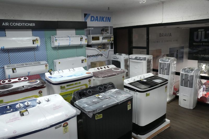 Air conditioners and appliances on a showroom floor